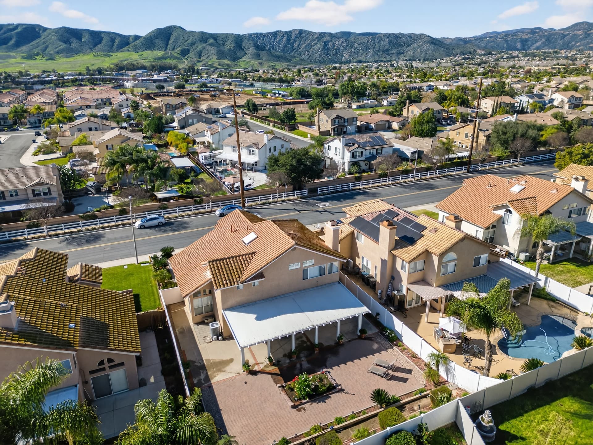 Aerial drone shot — Inland Empire neighborhood with mountain backdrop