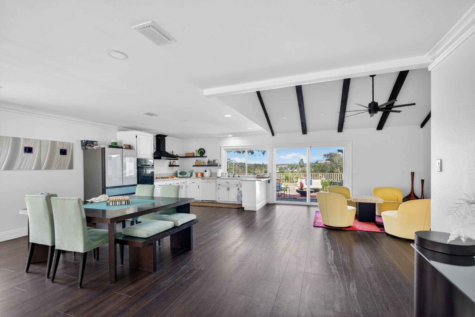 Open concept kitchen living room with vaulted beams — Riverside County