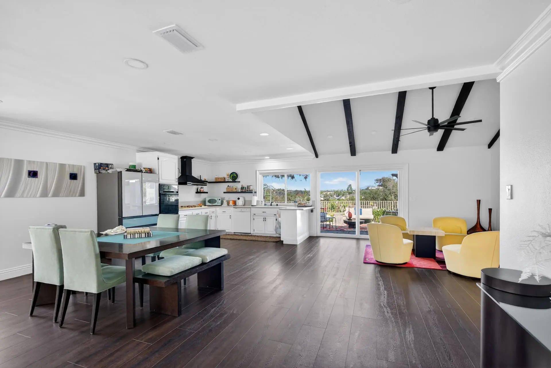 Open concept kitchen living room with vaulted beams — Norco, CA