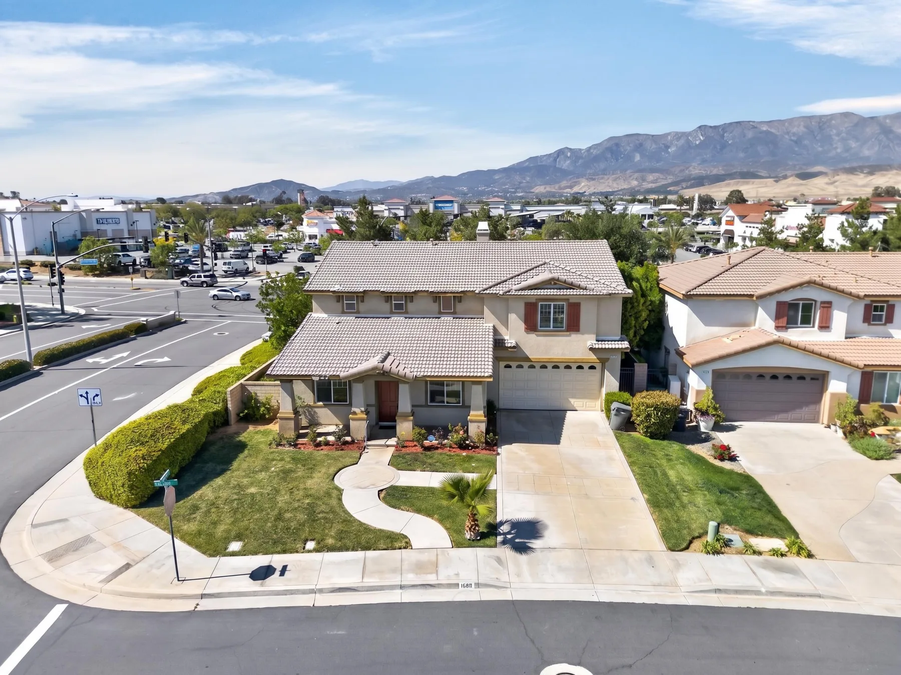 Before — original aerial photo with patchy lawn
