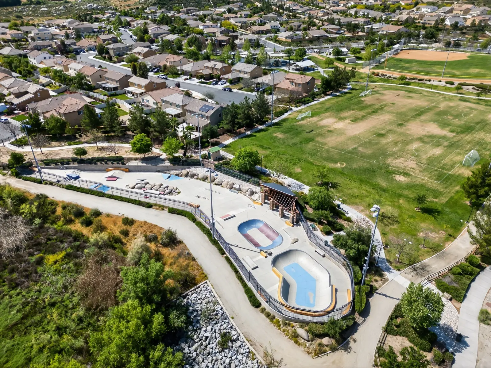 Pool complex with mountain backdrop — community photo by Vista Media Homes