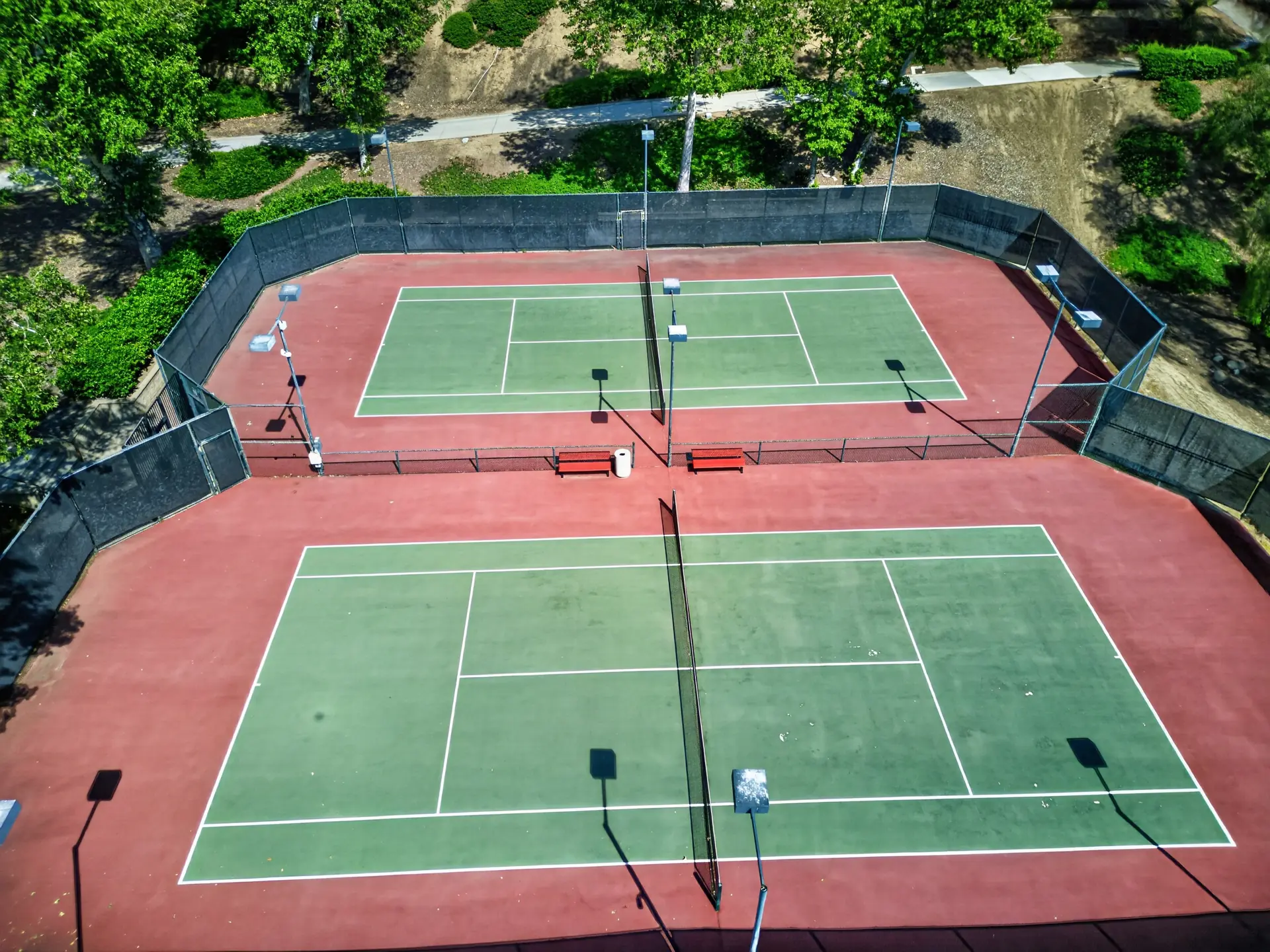 Aerial drone photo of pair of community tennis courts