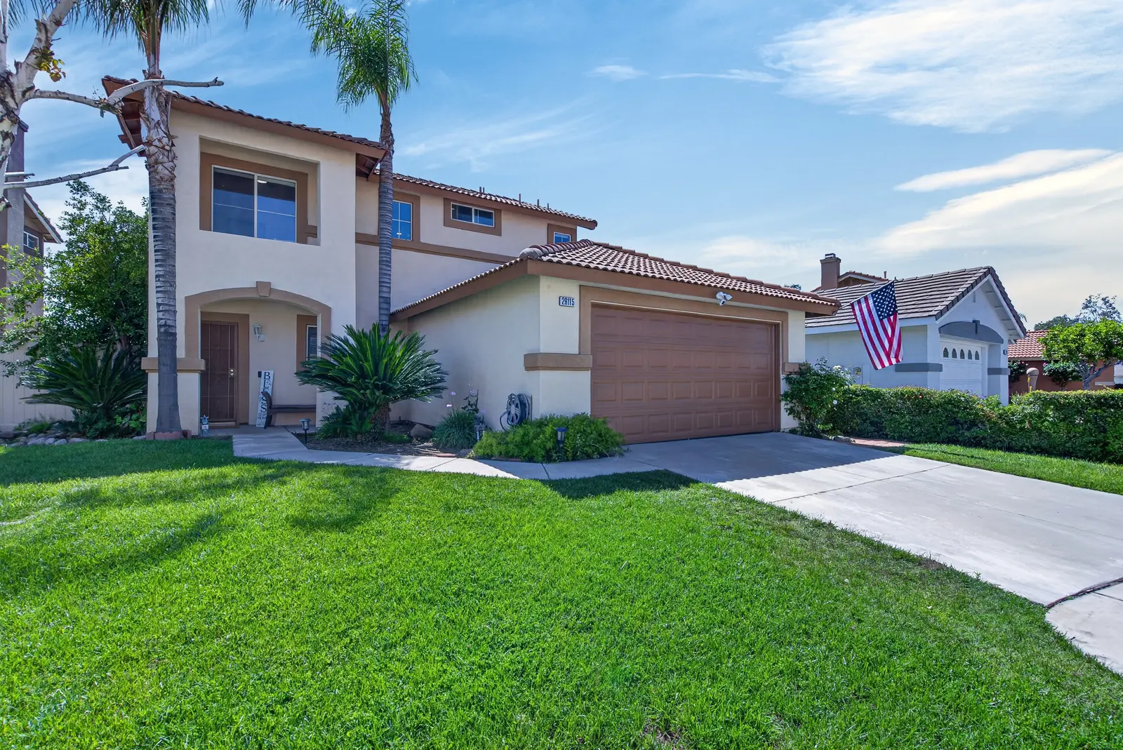 Ground exterior front of home with palm trees in Murrieta