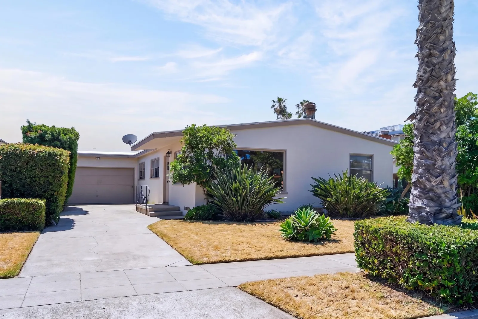 Front exterior after prep — car moved, plants trimmed, walkway clear